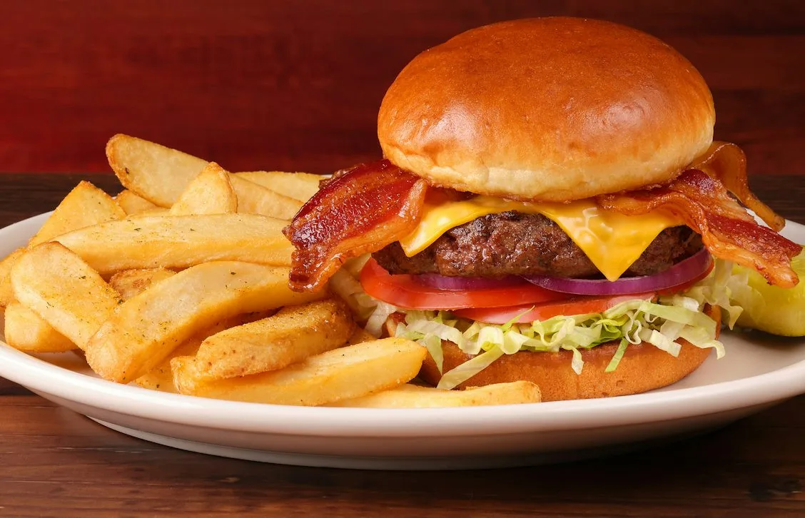 Bacon cheeseburger from the national menu, shown on the TRH Menu contact page.