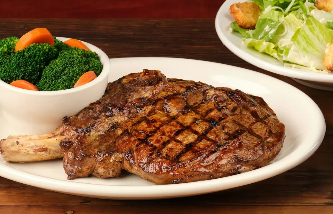 Bone-in ribeye from the national menu, used on this Texas Roadhouse menu guide.